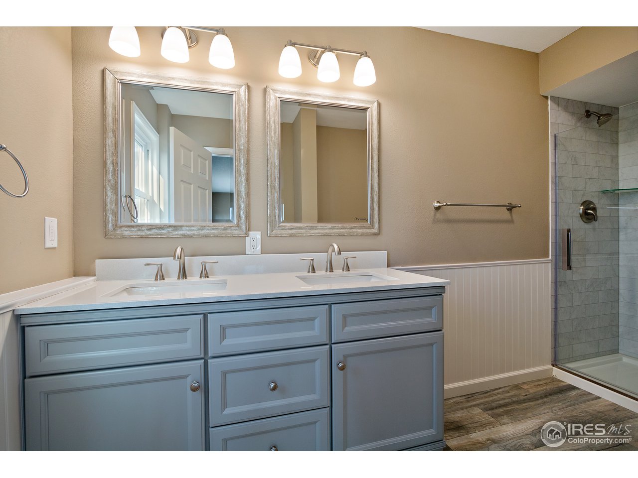 9088 North Awl Road Parker, CO 80138 - Photo 22 of 40 a bathroom with a sink and a mirror