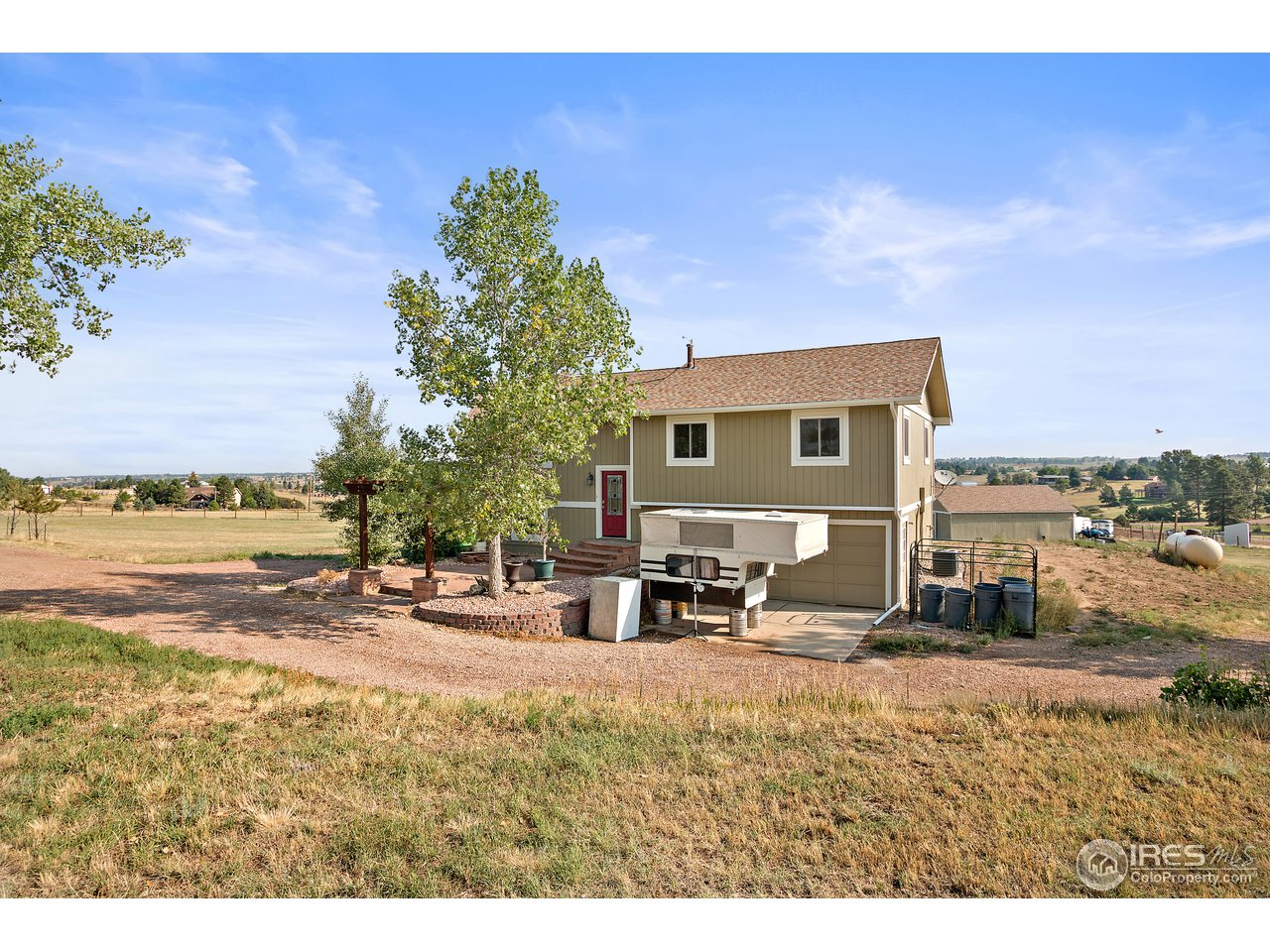 9088 North Awl Road Parker, CO 80138 - Photo 4 of 40 a view of a ocean with a house in the background
