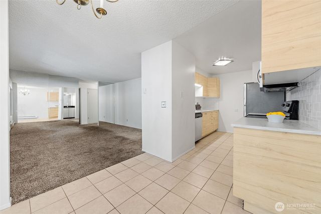 a view of a kitchen with furniture and a kitchen view