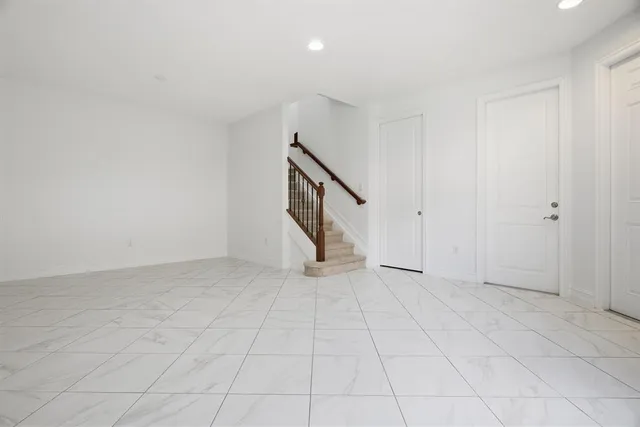 a view of an empty room with stairs