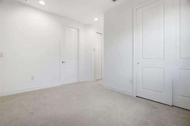 an empty room with closet area