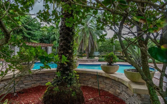 a view of a backyard with sitting area