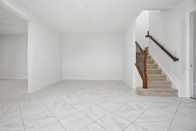 wooden floor in a hall with a window
