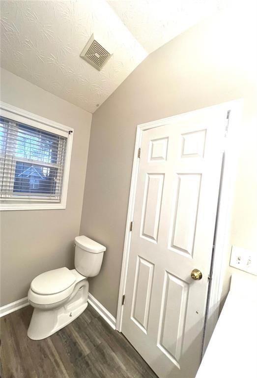 3854 Austin Park Lane Decatur, GA 30032 - Photo 28 of 44 a white toilet sitting next to a bathroom sink