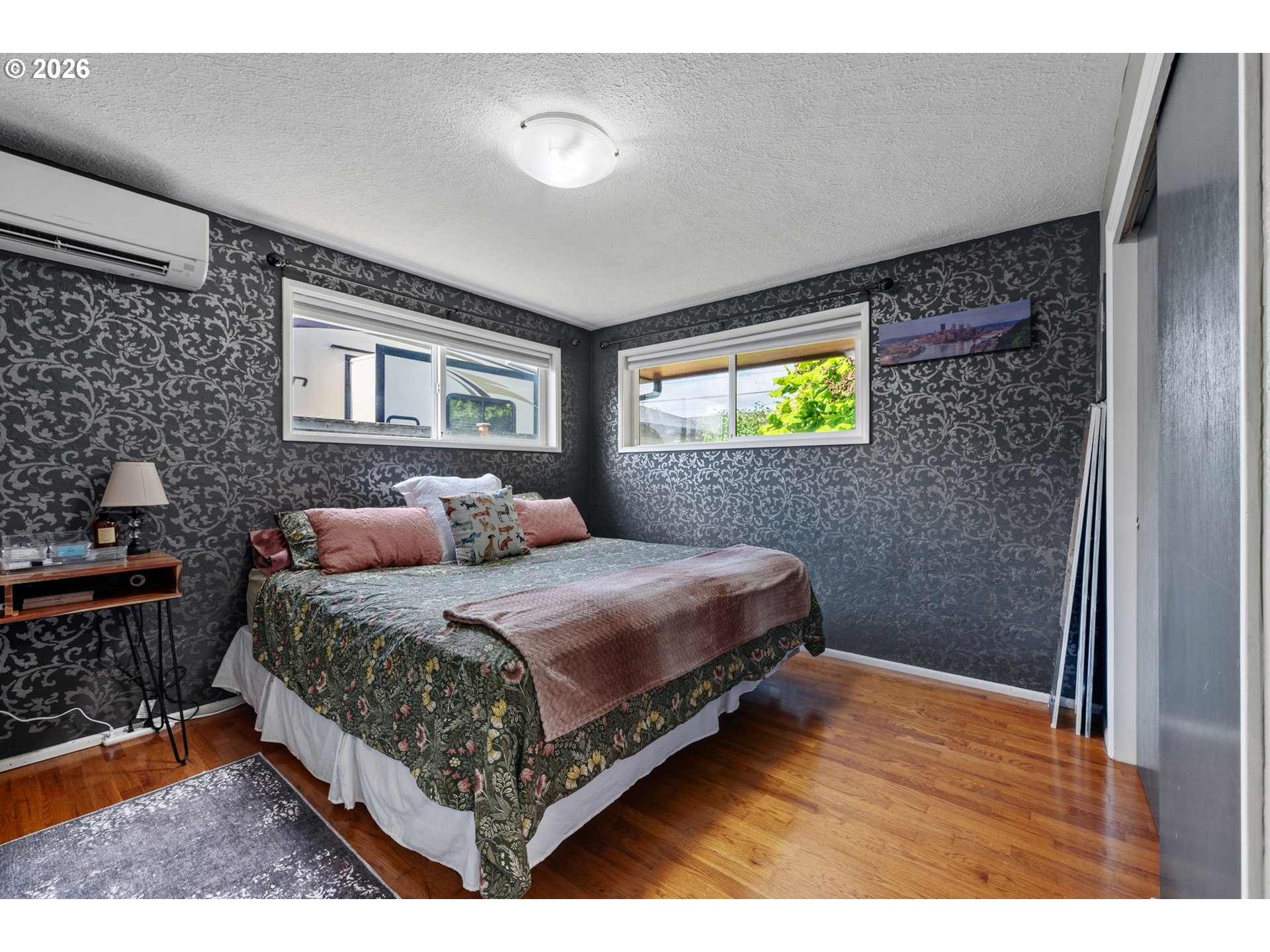 2936 Game Farm Road Springfield, OR 97477 - Photo 13 of 25 a bedroom with a bed and painting on the wall
