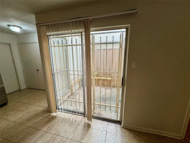 a view of a room with sliding glass door