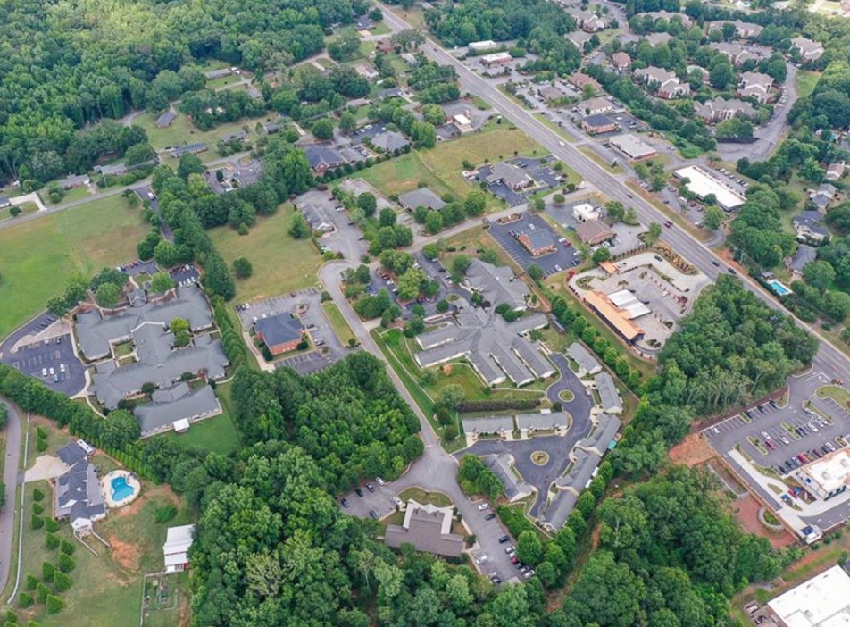 120 Perpetual Square Drive Anderson, SC 29621 - Photo 12 of 14 An aerial perspective reveals a vibrant neighborhood with ample green spaces and well-maintained roadways.