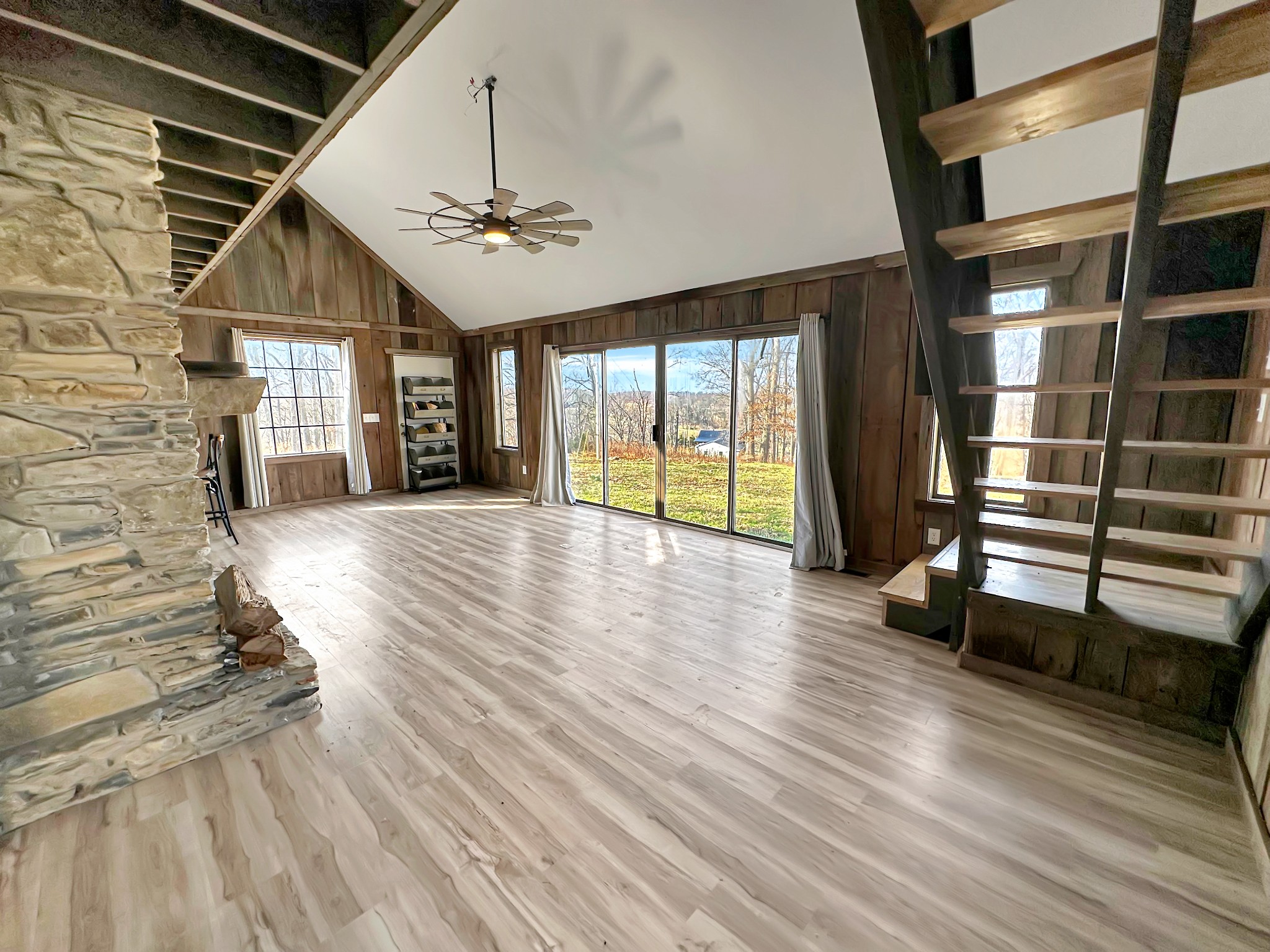 1041 Old Mt Vernon Road Bethpage, TN 37022 - Photo 11 of 46 an empty room with wooden floor chandelier and windows