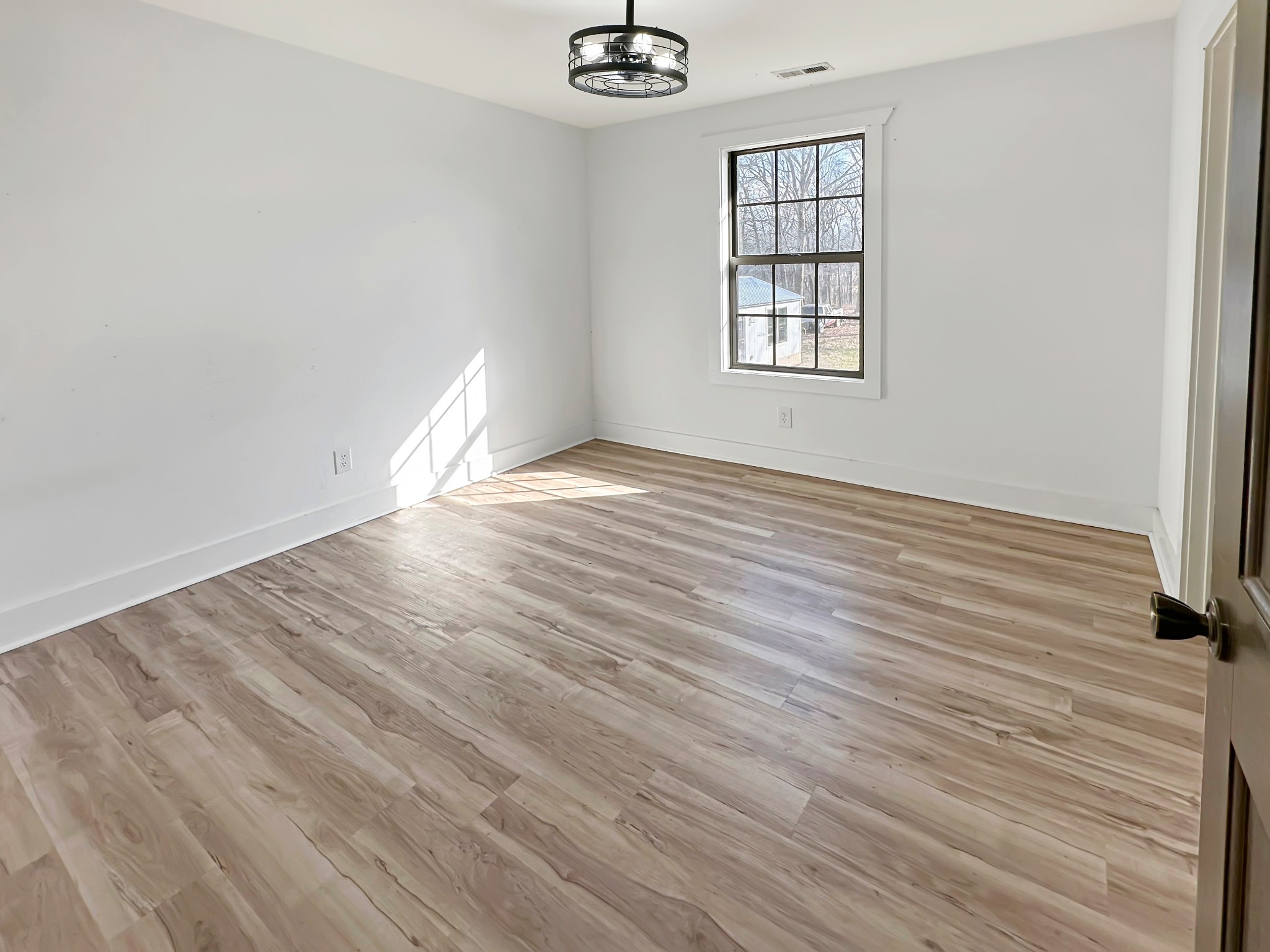 1041 Old Mt Vernon Road Bethpage, TN 37022 - Photo 15 of 46 an empty room with wooden floor and windows