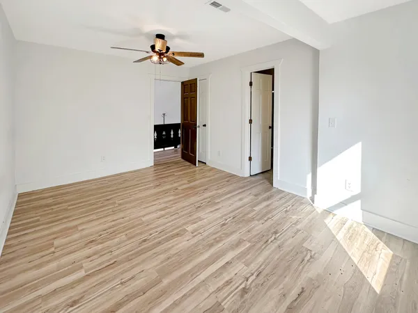 a view of livingroom with hardwood floor and kitchen stove