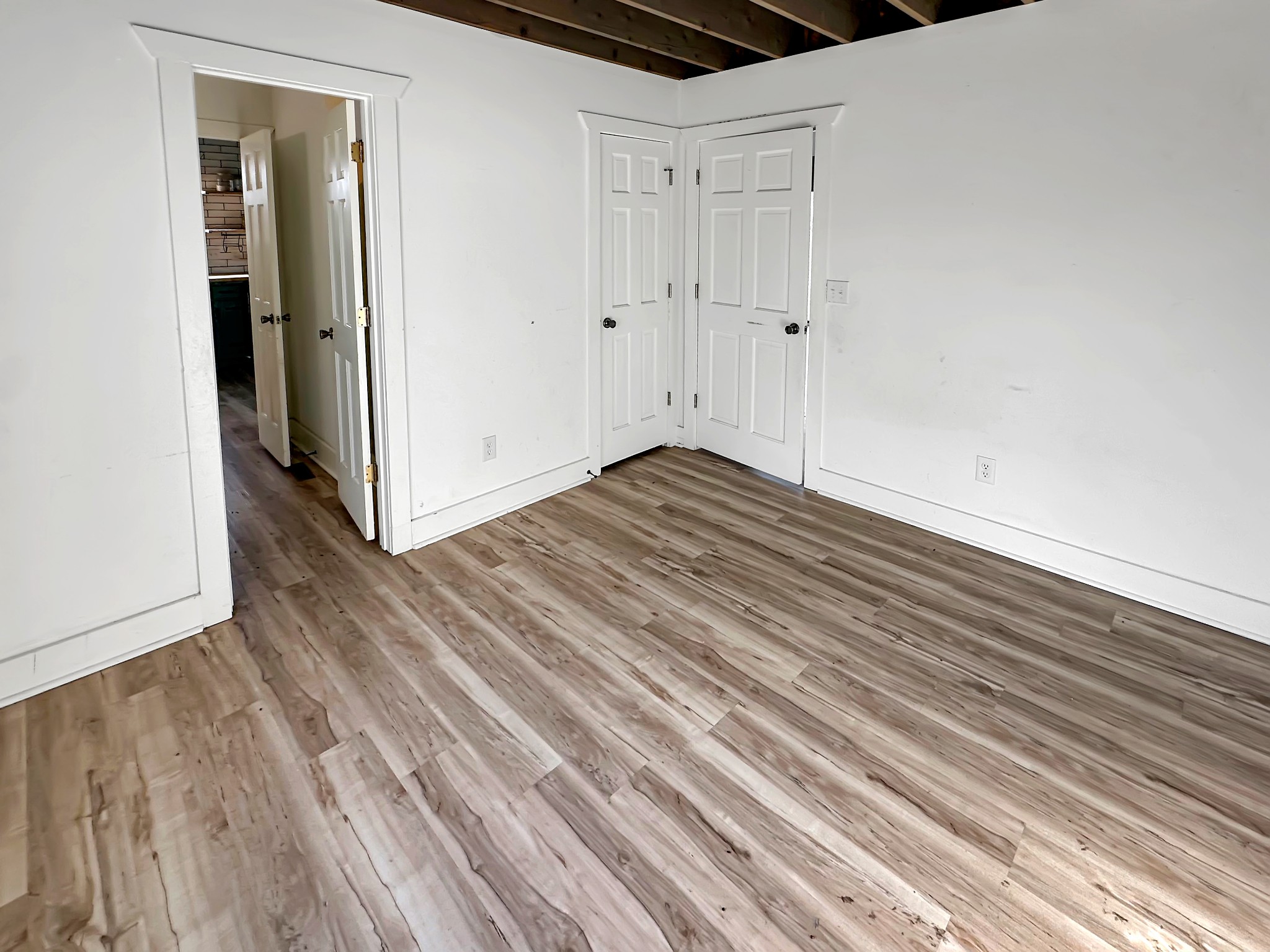 1041 Old Mt Vernon Road Bethpage, TN 37022 - Photo 18 of 46 a view of a room with wooden floor and white doors
