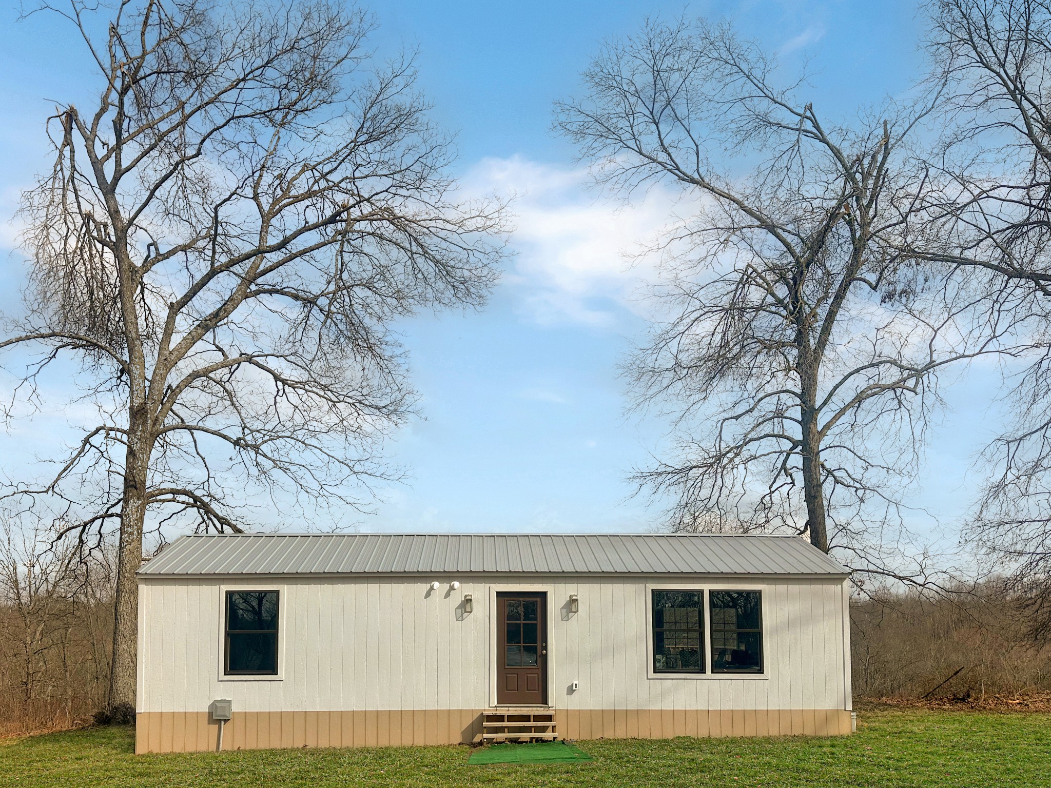 1041 Old Mt Vernon Road Bethpage, TN 37022 - Photo 25 of 46 a front view of a house with a yard and garage