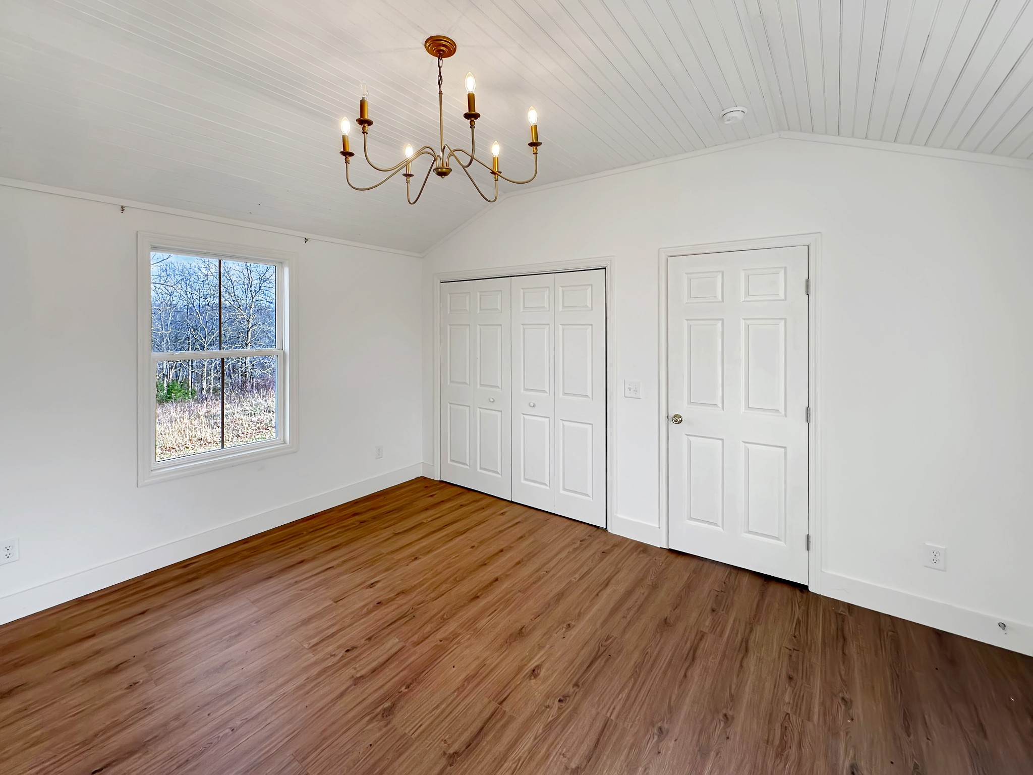 1041 Old Mt Vernon Road Bethpage, TN 37022 - Photo 28 of 46 a view of an empty room with wooden floor and a window