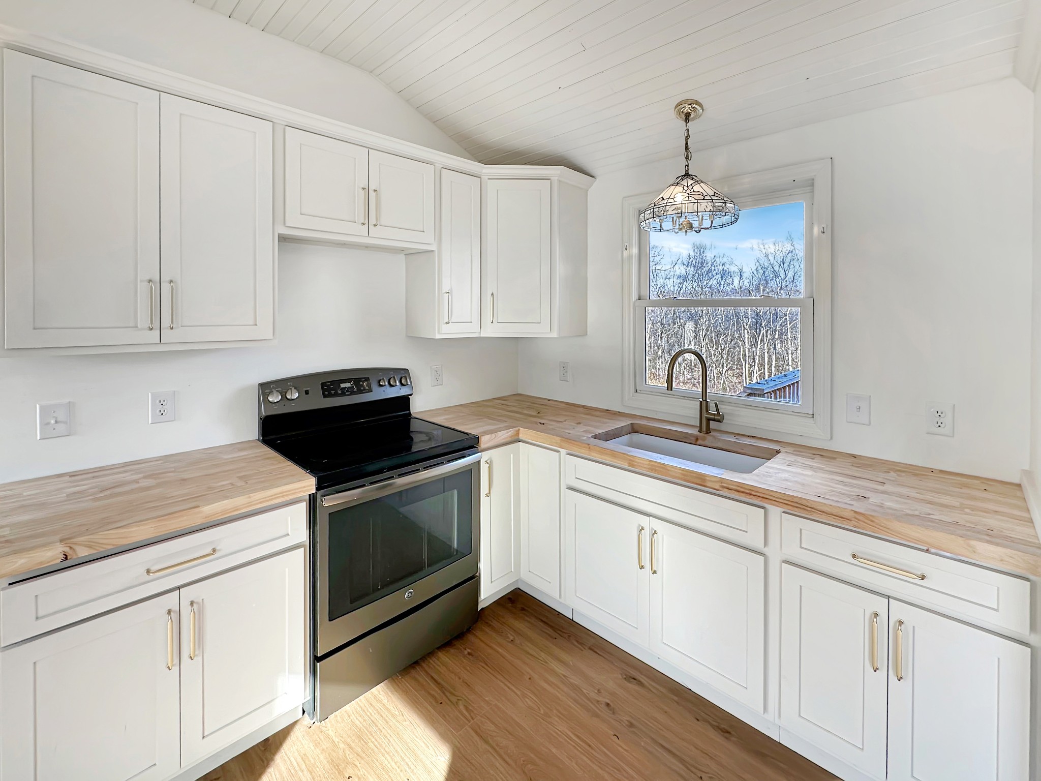 1041 Old Mt Vernon Road Bethpage, TN 37022 - Photo 30 of 46 a kitchen with white cabinets and a sink