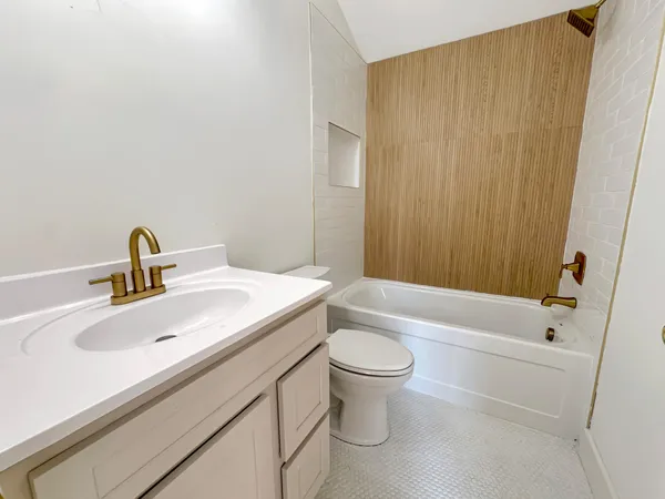 a bathroom with a sink and mirror