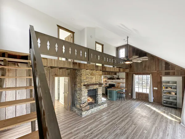 a view of a livingroom with furniture and window