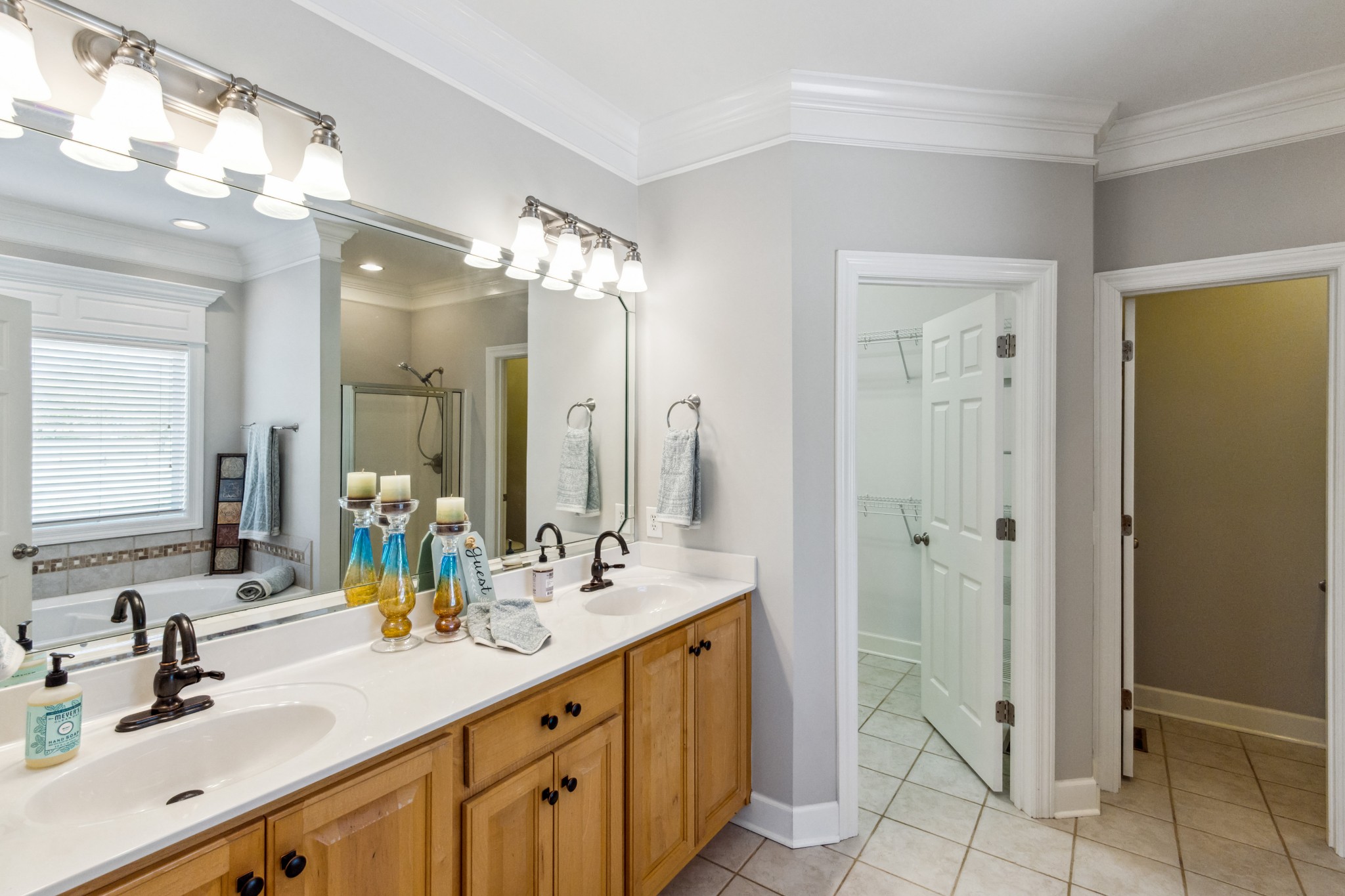 5592 Cedar Grove Road Murfreesboro, TN 37127 - Photo 15 of 43 Here's the Primary Bedroom's adjoining Full Bath with vanity with two sinks, nice cabinetry, a large mirror and tile floor!