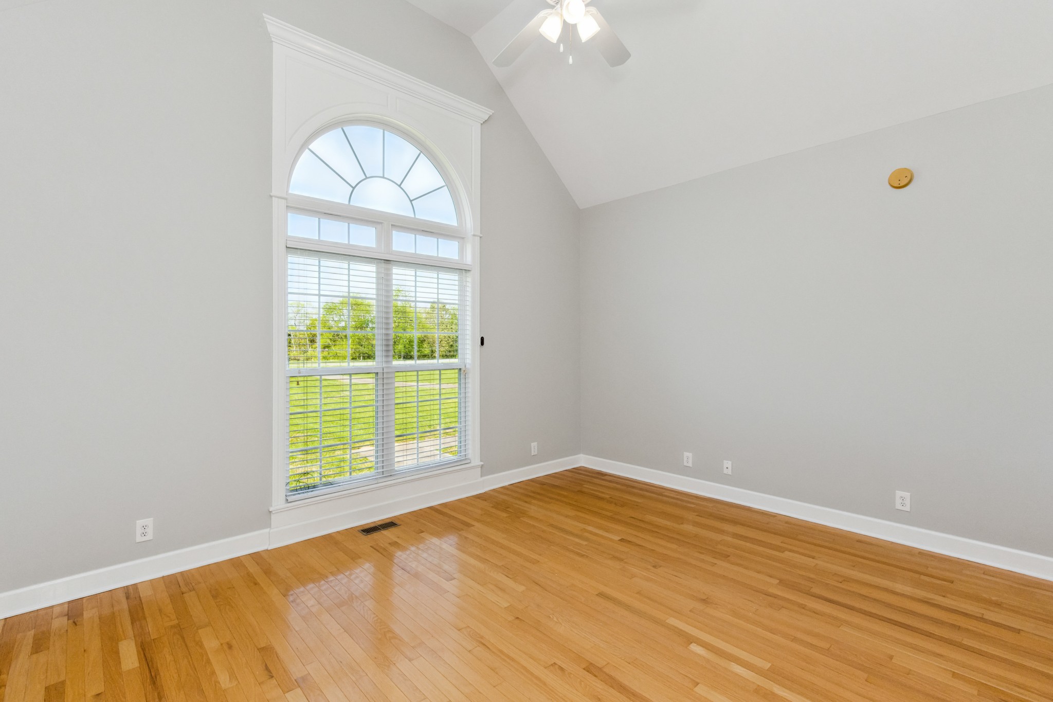 5592 Cedar Grove Road Murfreesboro, TN 37127 - Photo 22 of 43 Bedroom #3 faces the front yard and has a beautiful double window with arched window, vaulted ceiling, hardwood floor, ceiling fan, and an extra long closet!