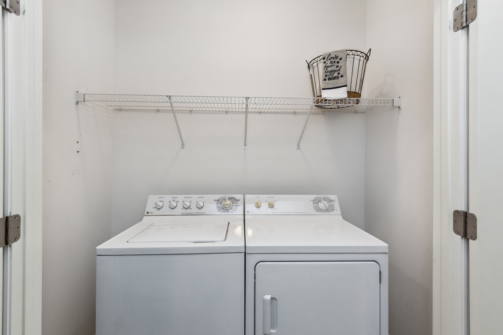 5592 Cedar Grove Road Murfreesboro, TN 37127 - Photo 25 of 43 The Laundry area is located off the Kitchen, has a wire shelf, tile floor, and best part is that the Washer & Dryer remain!
