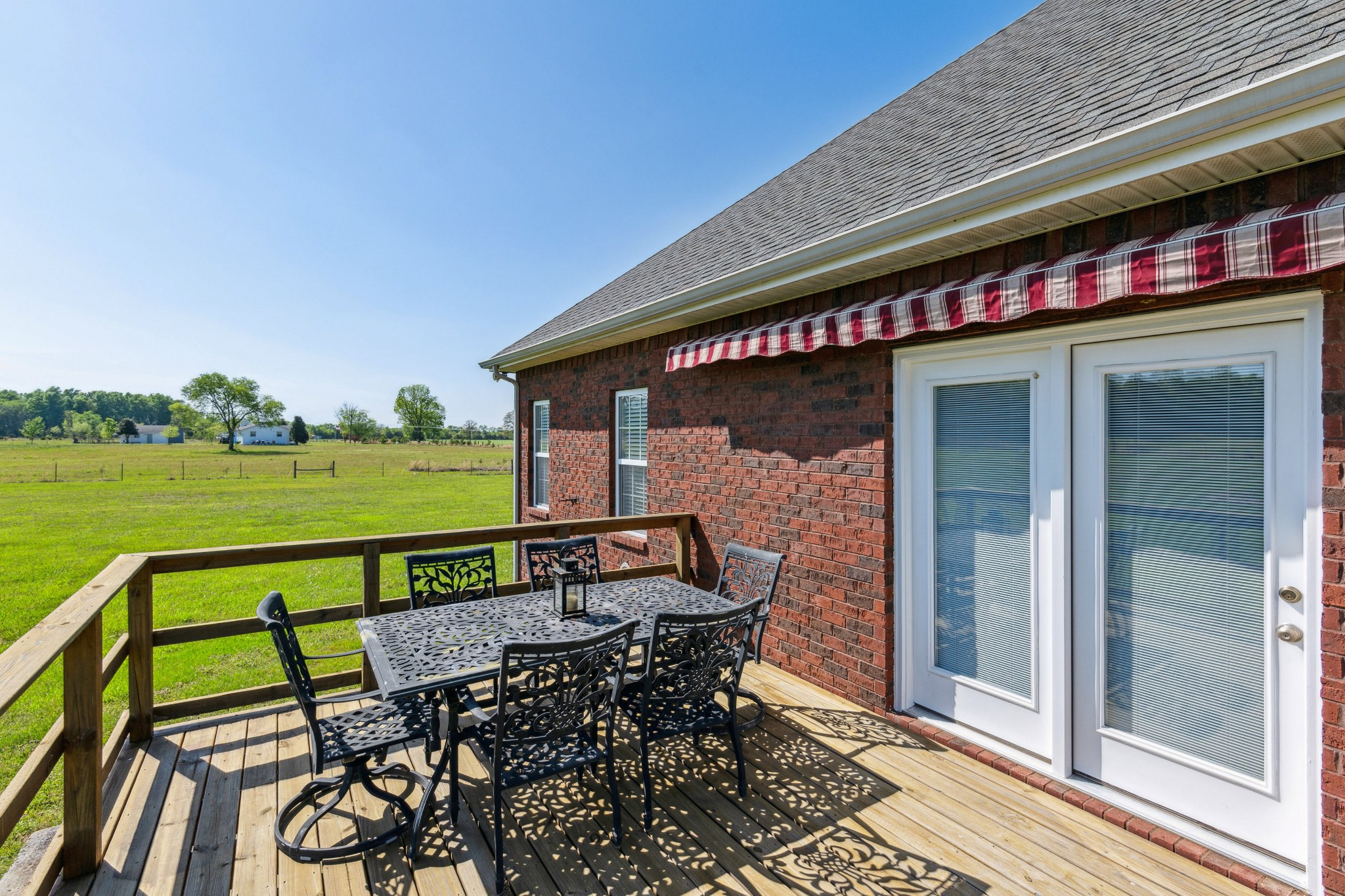 5592 Cedar Grove Road Murfreesboro, TN 37127 - Photo 28 of 43 Here's the deck off the Living/Great Room, which is a nice size to be able to hold a table for 6 and still have additional room! You can see it also has an awning for those hot summer days!