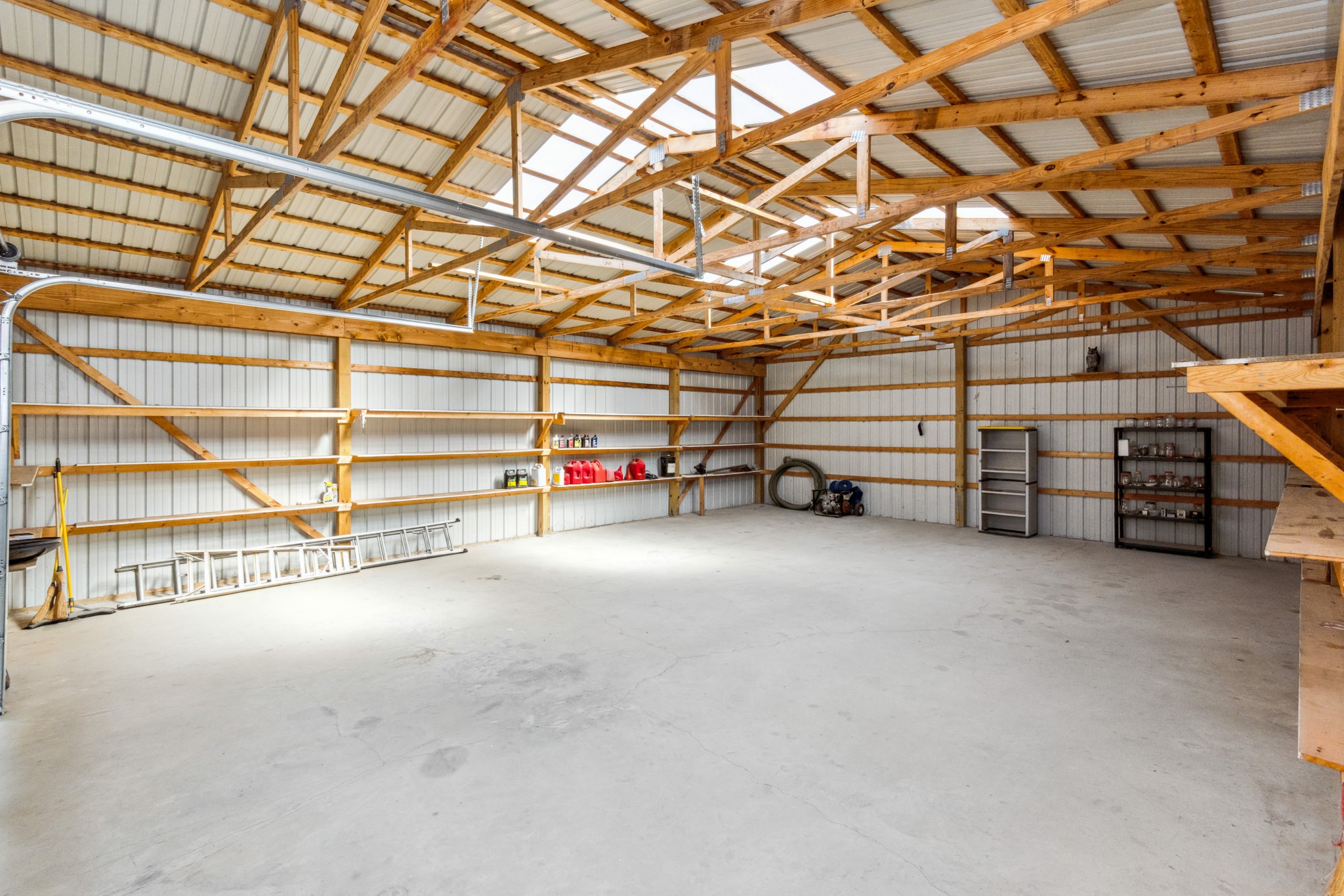 5592 Cedar Grove Road Murfreesboro, TN 37127 - Photo 34 of 43 Here's the inside of the shop/garage, with natural lighting from above, plenty of built-in shelving, as well as a concrete floor (that looks almost new)! It doesn't have electricity but also could be modified as needed by the buyers!