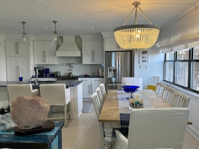306 Pacifica Vista Way St. Augustine, FL 32080 - Photo 12 of 18 a living room with furniture and a chandelier