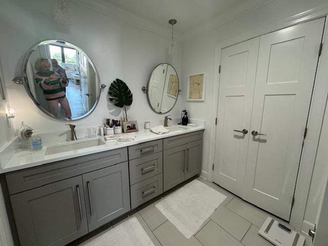 306 Pacifica Vista Way St. Augustine, FL 32080 - Photo 14 of 18 a spacious bathroom with a double vanity sink and a mirror
