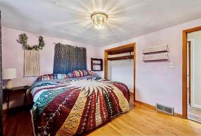 501 Highway 356 Apollo, PA 15613 - Photo 15 of 36 a bedroom with a bed and a chandelier