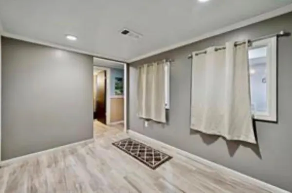 a view of a room with window and walk in closet
