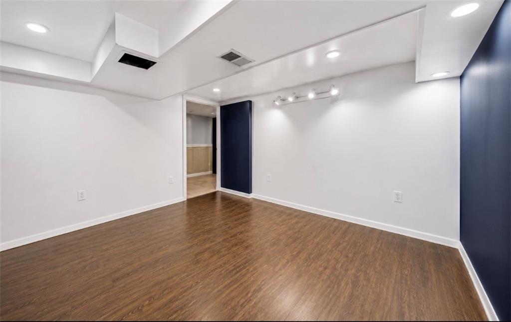 501 Highway 356 Apollo, PA 15613 - Photo 23 of 36 an empty room with wooden floor and windows
