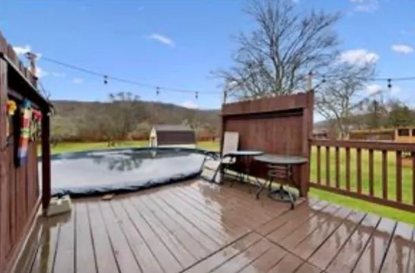 a view of a house with a yard from a fountain