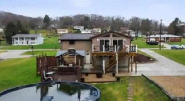 an aerial view of a house having patio yard and a patio