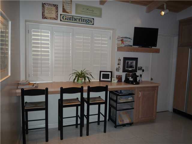 12152 Gay Rio Drive Lakeside, CA 92040 - Photo 12 of 24 Bar in kitchen the door to the right is the walk-in pantry leading to garage