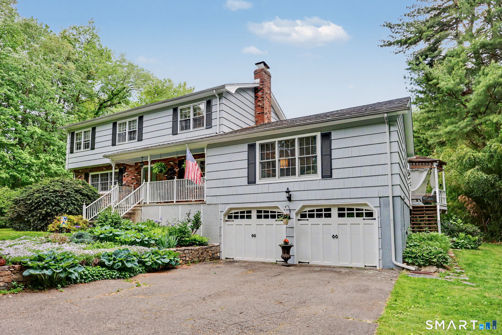 571 Wheeler Road Monroe, CT 06468 - Photo 39 of 40 a front view of a house with a garden