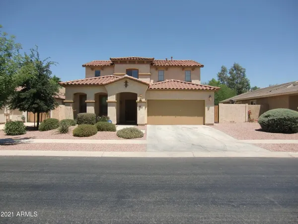 a front view of a house with a garage