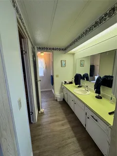 a large room with a lot of furniture and wooden floor