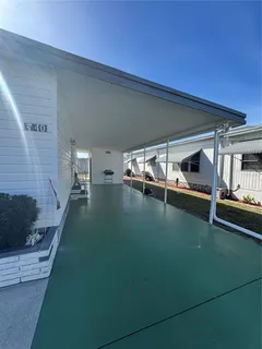 a view of swimming pool with outdoor seating