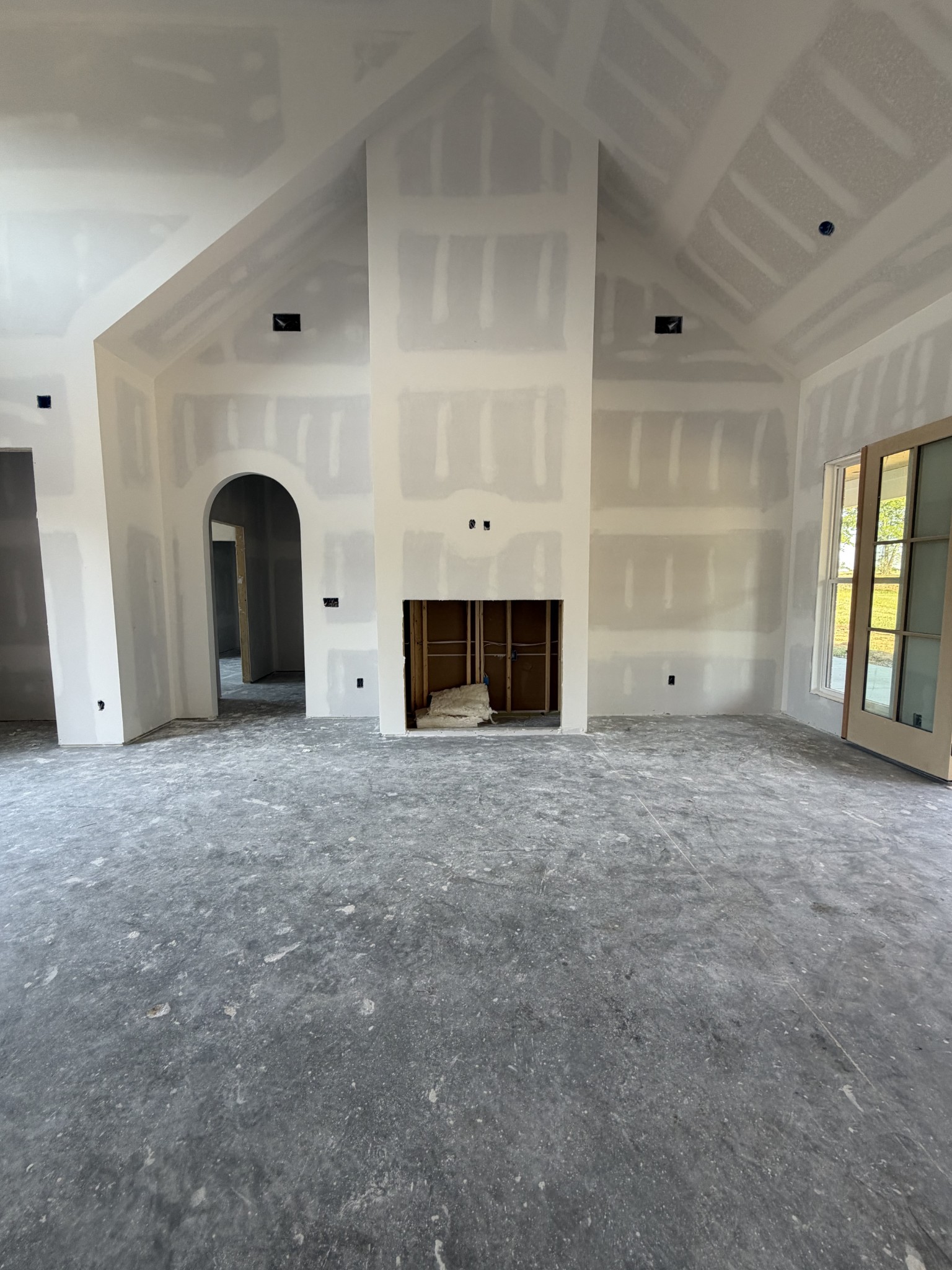 5 Pace Road Clarksville, TN 37043 - Photo 8 of 20 an empty room with a fireplace and window