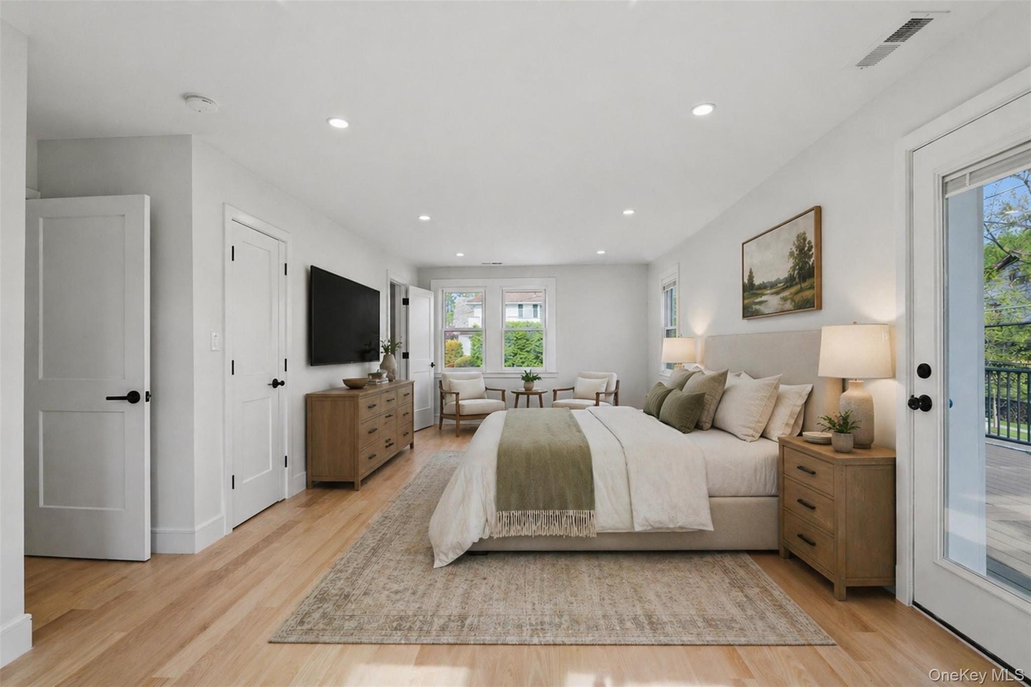 40 Calhoun Avenue New Rochelle, NY 10801 - Photo 22 of 49 Spacious room featuring light wood-finish flooring, recessed lighting, and white paneled doors with black hardware