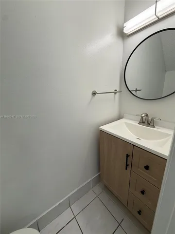 a bathroom with a sink and mirror
