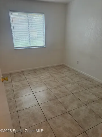 a view of a room that has a window in it