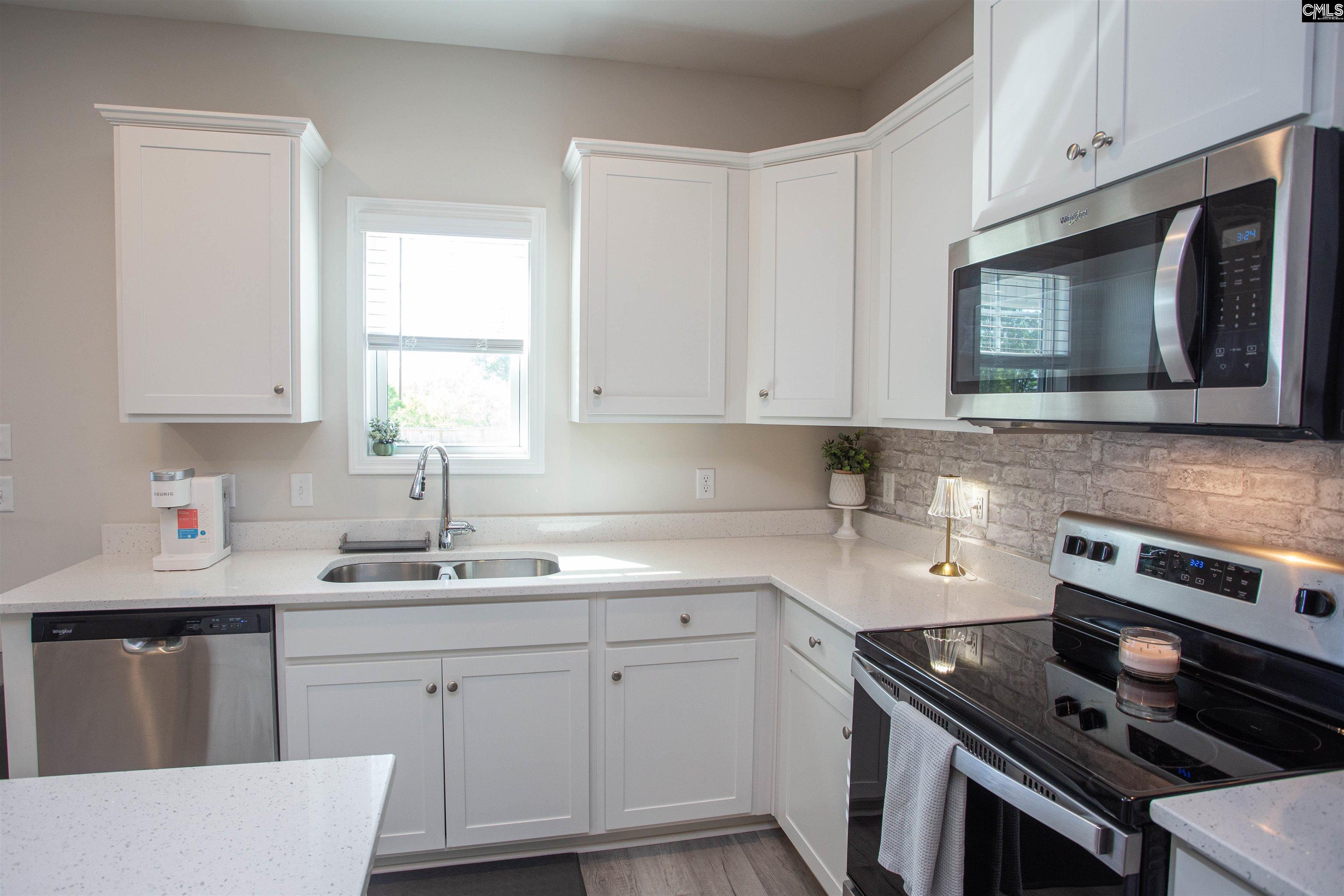 272 Shadowbrook Way Camden, SC 29020 - Photo 10 of 43 a kitchen with cabinets appliances a sink and a window