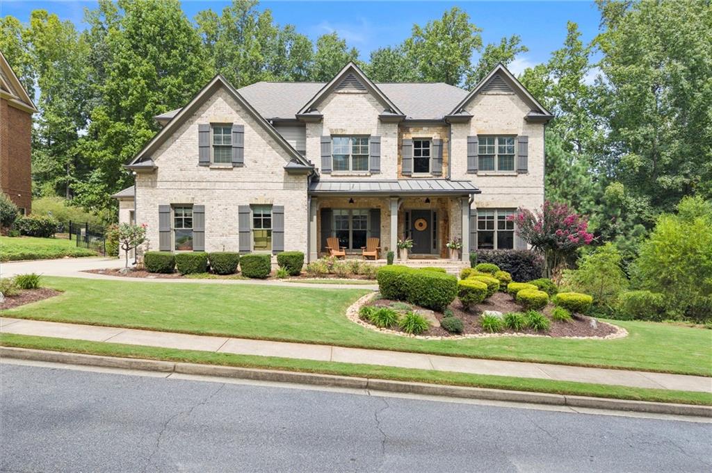 front view of a house with a yard