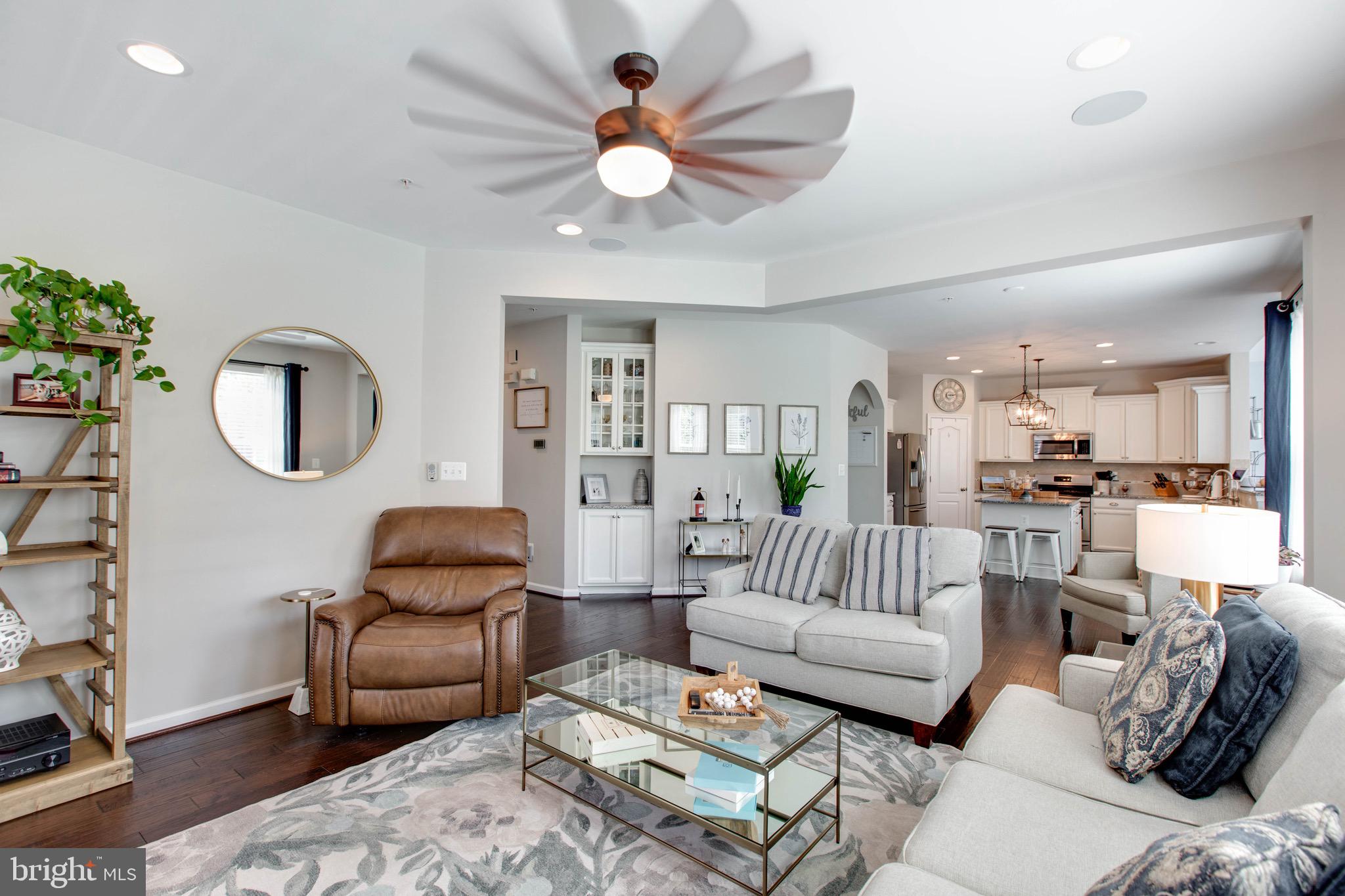 7870 Sunhaven Way Severn, MD 21144 - Photo 15 of 70 a living room with furniture ceiling fan and a rug