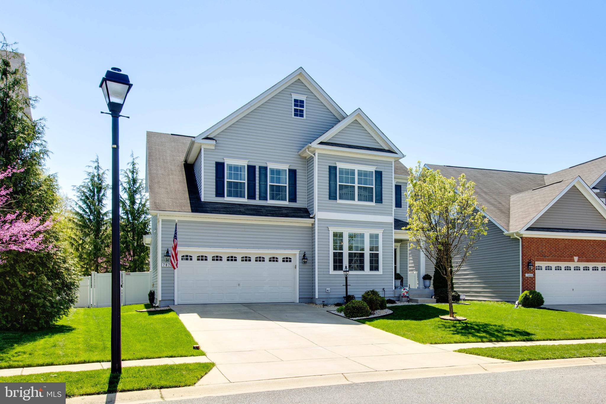 7870 Sunhaven Way Severn, MD 21144 - Photo 2 of 70 a front view of a house with garden