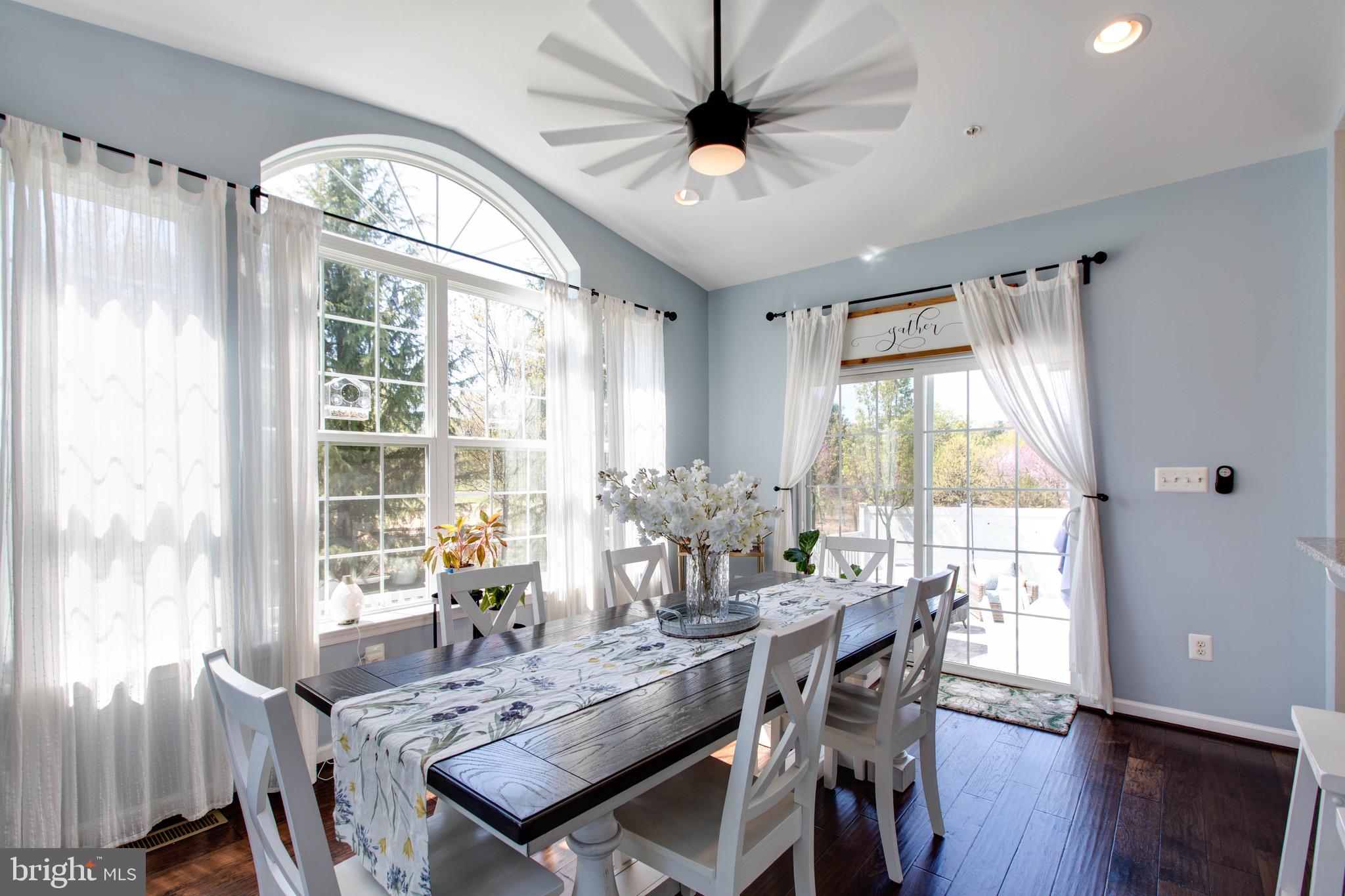 7870 Sunhaven Way Severn, MD 21144 - Photo 23 of 70 a view of a dining room with furniture window and wooden floor