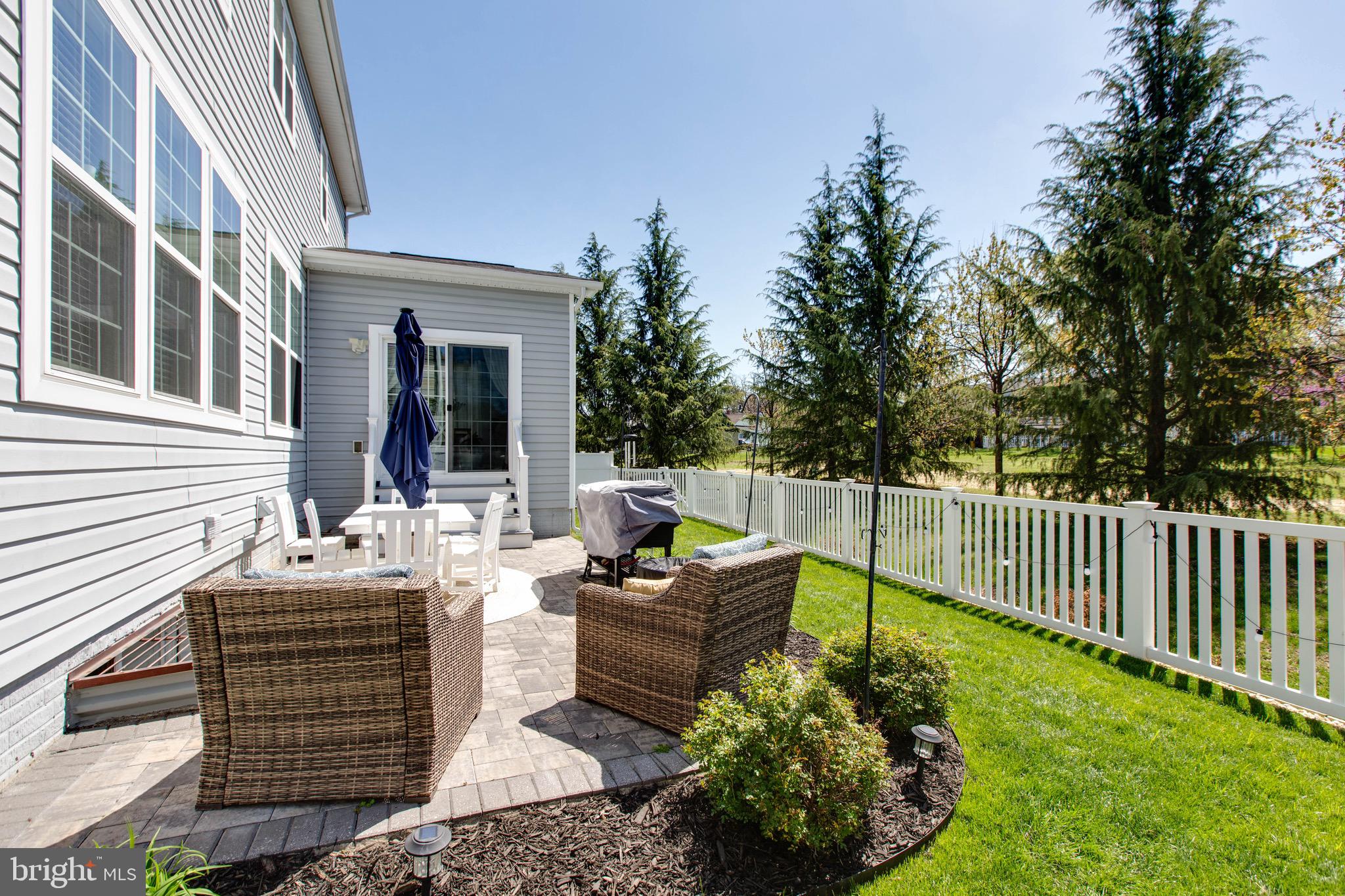 7870 Sunhaven Way Severn, MD 21144 - Photo 27 of 70 a view of a patio with couches table and chairs and potted plants