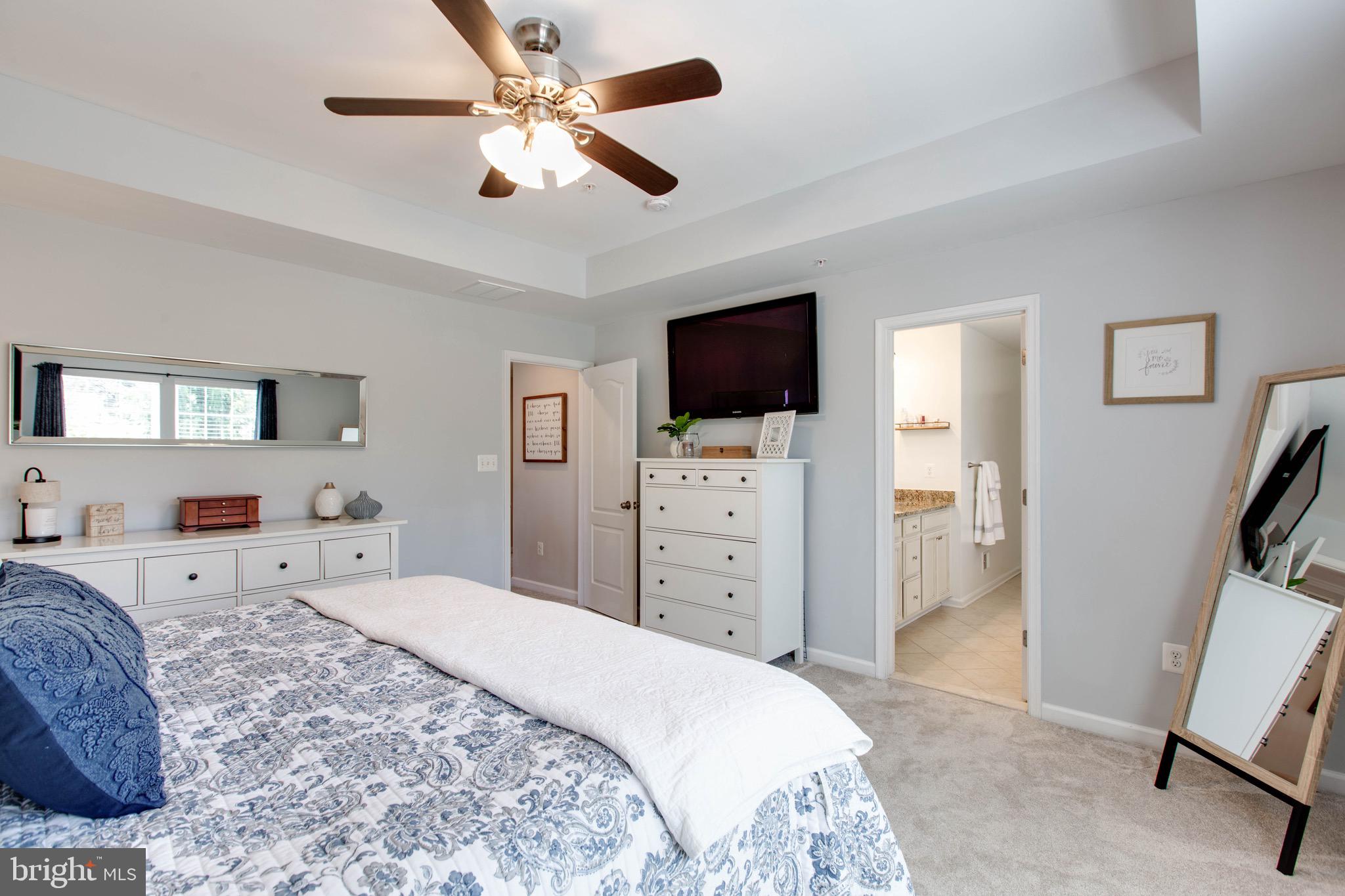 7870 Sunhaven Way Severn, MD 21144 - Photo 30 of 70 a bedroom with a bed and a flat screen tv