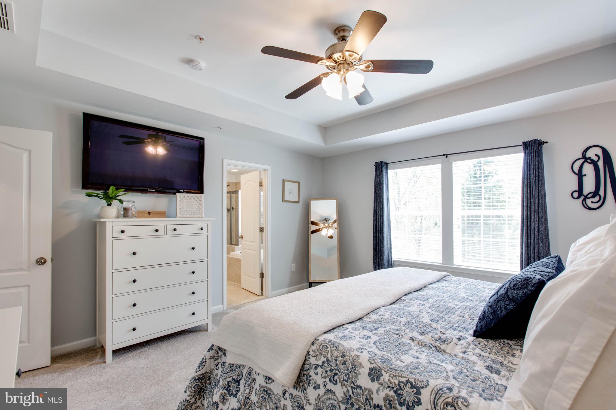 7870 Sunhaven Way Severn, MD 21144 - Photo 31 of 70 a bedroom with a bed and a flat screen tv