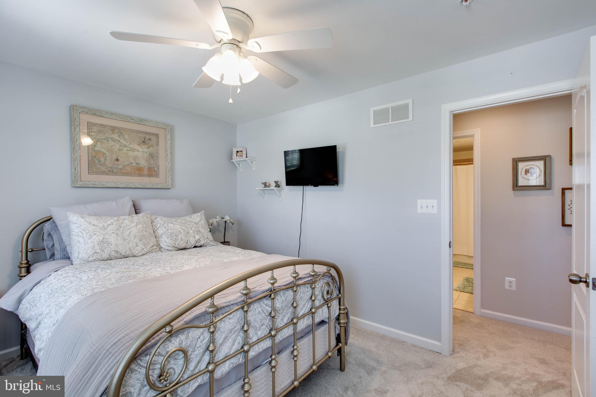 7870 Sunhaven Way Severn, MD 21144 - Photo 42 of 70 a bedroom with a bed and a flat screen tv